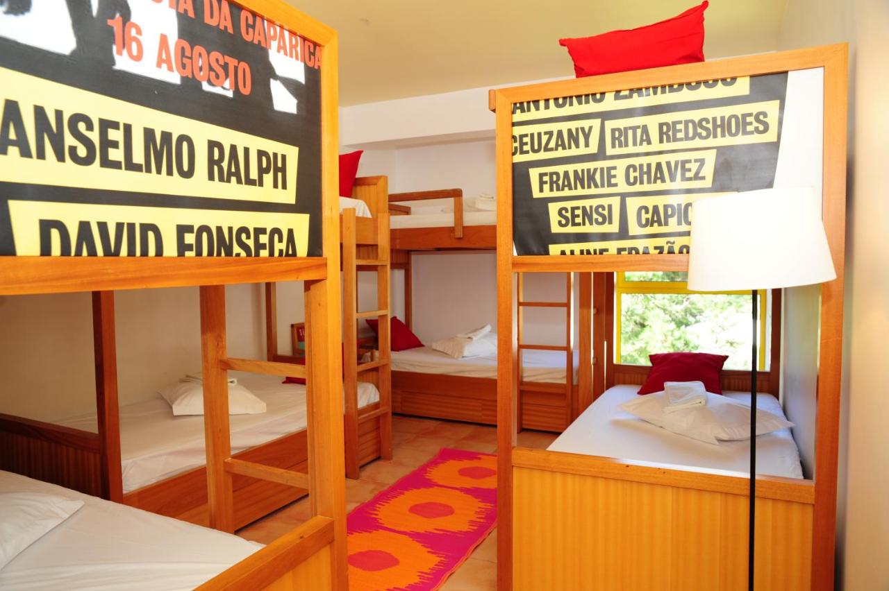 Bunk beds with name cards in a shared dormitory room at the junior camp