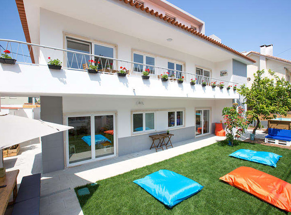 Exterior of the camp house with garden, terrace and outdoor seating