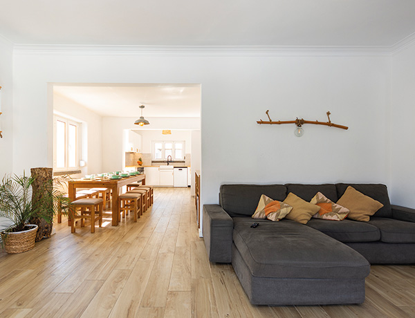 Open-plan living and dining area in our surf camp Portugal house near Lisbon
